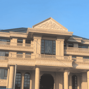 辽宁黄金麻别墅外墙干挂石材效果示例